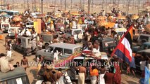 Naga Sadhus use Hindustan Ambassador glass to do up their matted hair!