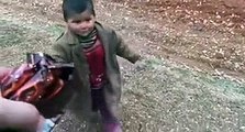 Syrian Kid Receiving Lots Of Love & Chocolates From The Turkish Soldiers