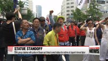 Civic group clashes with police in Busan as it tries to erect statue for victims of Japan's forced labor