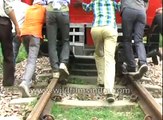 Only in India- Passengers push broken down train!