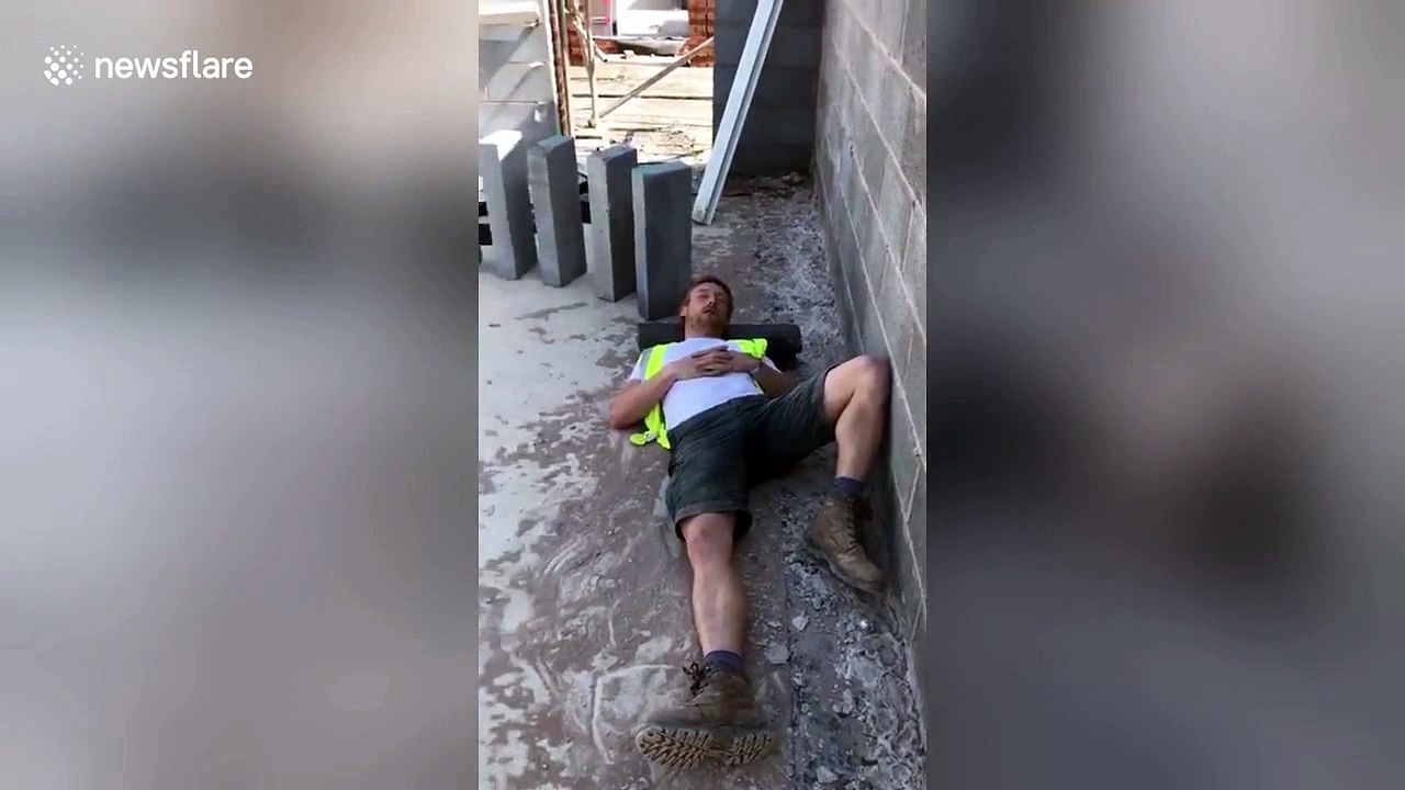 Hilarious moment builder topples concrete slabs to wake up napping mate