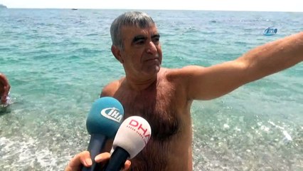 100 metre açıkta sırtüstü yüzen adam deniz polisini alarma geçti