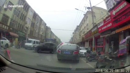 Newbie motorist drives onto top of bonnet of another car