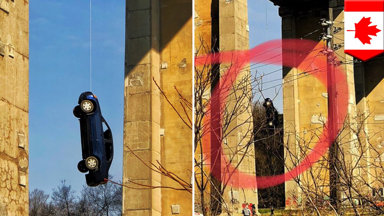 Toronto cops suspects pranksters for car hanging from bridge - TomoNews