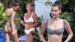 Bella Hadid pulls up her bikini bottoms while Hailey Baldwin looks cool in white as wild Miami trip continues