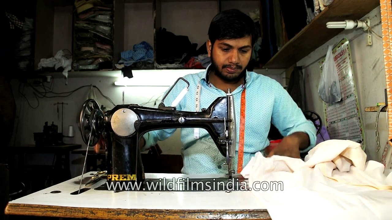 Old fashioned sewing machine in operation