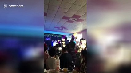 Bride's bouquet toss causes ceiling to collapse on top of guests
