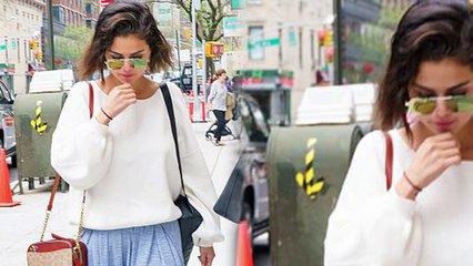 Selena Gomez sports white blouse and loose fitting trousers in New York City as new single release looms.