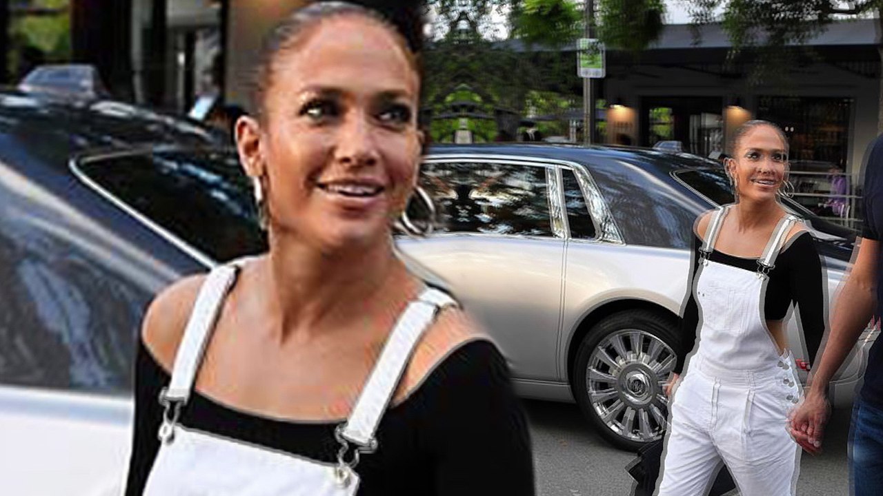 Jennifer Lopez, 5ft5in, stares up at her beau Alex Rodriguez, 6ft3in, as they walk hand-in-hand.