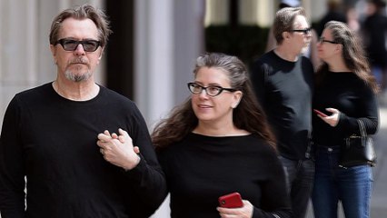Gary Oldman packs on the PDA with his fifth wife Gisele Schmidt as they enjoy lunch in New York