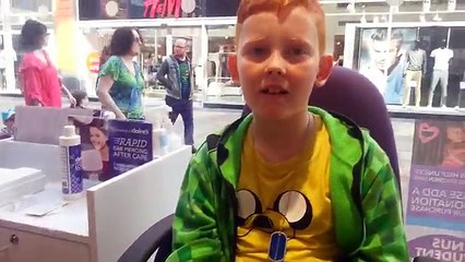 My son getting his ear pierced at Claires Accessories!