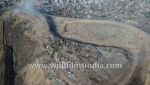 Smoking mountain of garbage- dystopian India at Bhalswa landfill