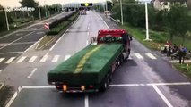 Lorry takes out traffic lights before crashing into river to avoid scooter