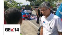 EC officers remove Pakatan-endorsed candidate’s banners