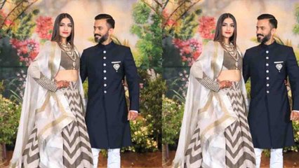 Descargar video: Sonam Kapoor - Anand Ahuja Black & White Dress में पहुंचे Reception Party में | BoldSky