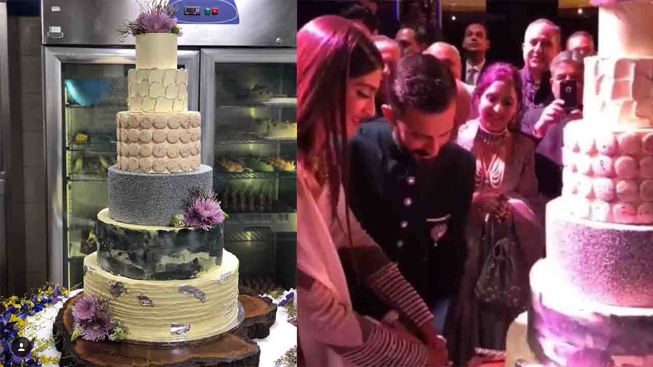 Sonam Kapoor Reception: Sonam- Anand cut the HUGE cake during Reception | FilmiBeat