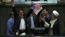 Iranian lawmakers burn US flag