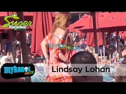 Lindsay Lohan reacts to the paparazzi in Mykonos