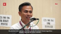 PKR's Fahmi Fadzil emerges victorious after a neck-and-neck battle with Raja Nong Chik