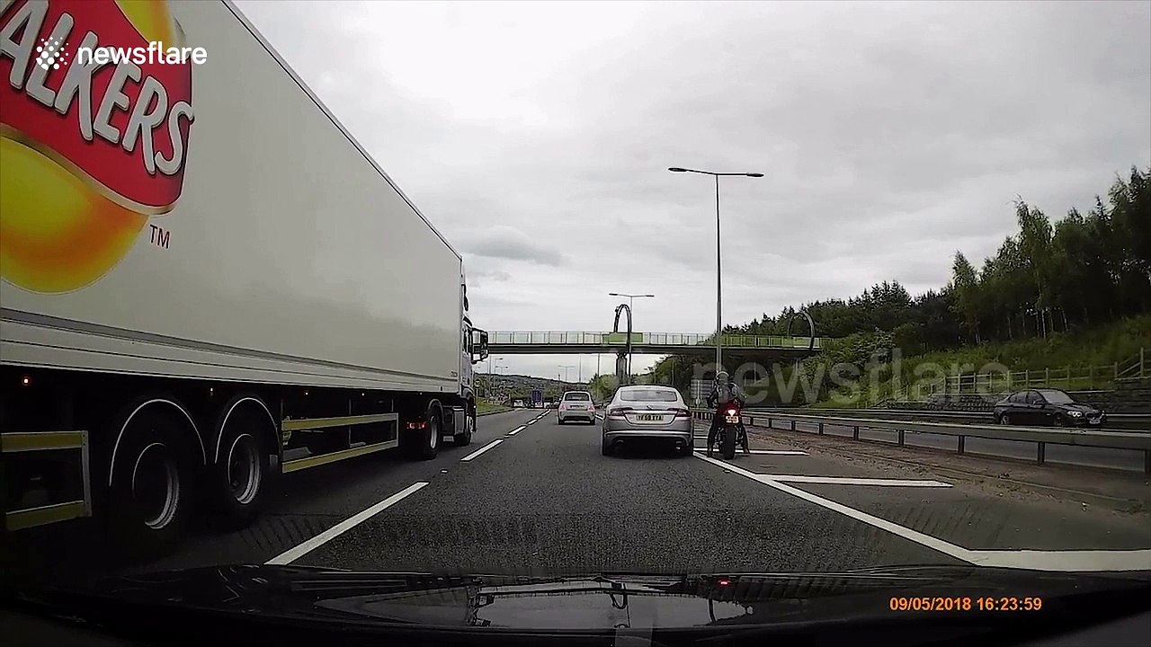 Internet reacts as biker and Jaguar driver get into heated rush-hour argument