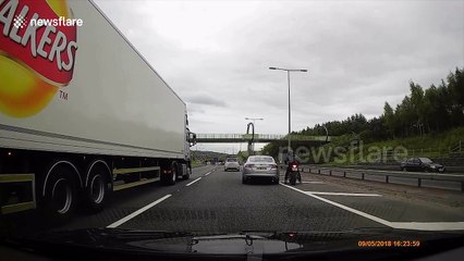 Internet reacts as biker and Jaguar driver get into heated rush-hour argument