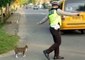Indonesian Police Officer Cuts Off Traffic to Help Cat Cross the Road, Twice