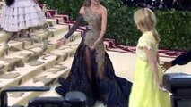 Madonna flashes her pert behind whilst twirling in Versace dress