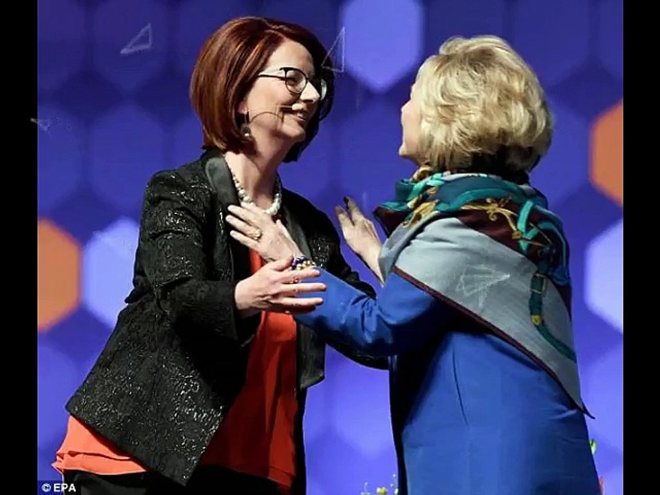 Hillary Clinton wears a scarf after suggestions she has a back brace