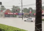 Debris, Floodwaters Wash Over Houston Streets, Businesses
