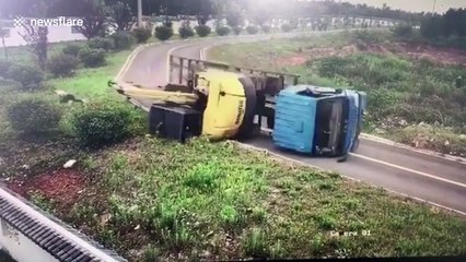Lucky passenger leaps out of lorry before it flips over at turning