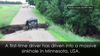 Teenager escapes car in huge sinkhole