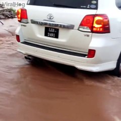 Crossing a flooded iver in a Toyota