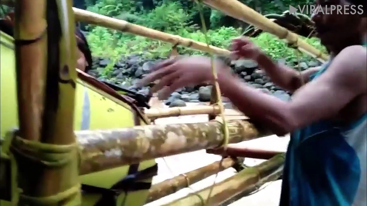 World's most dangerous school run? Kids cross raging river in bamboo basket