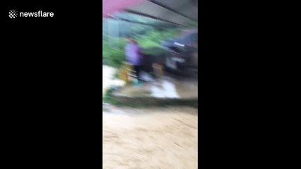 Severe flash flooding hits remote Vietnamese village
