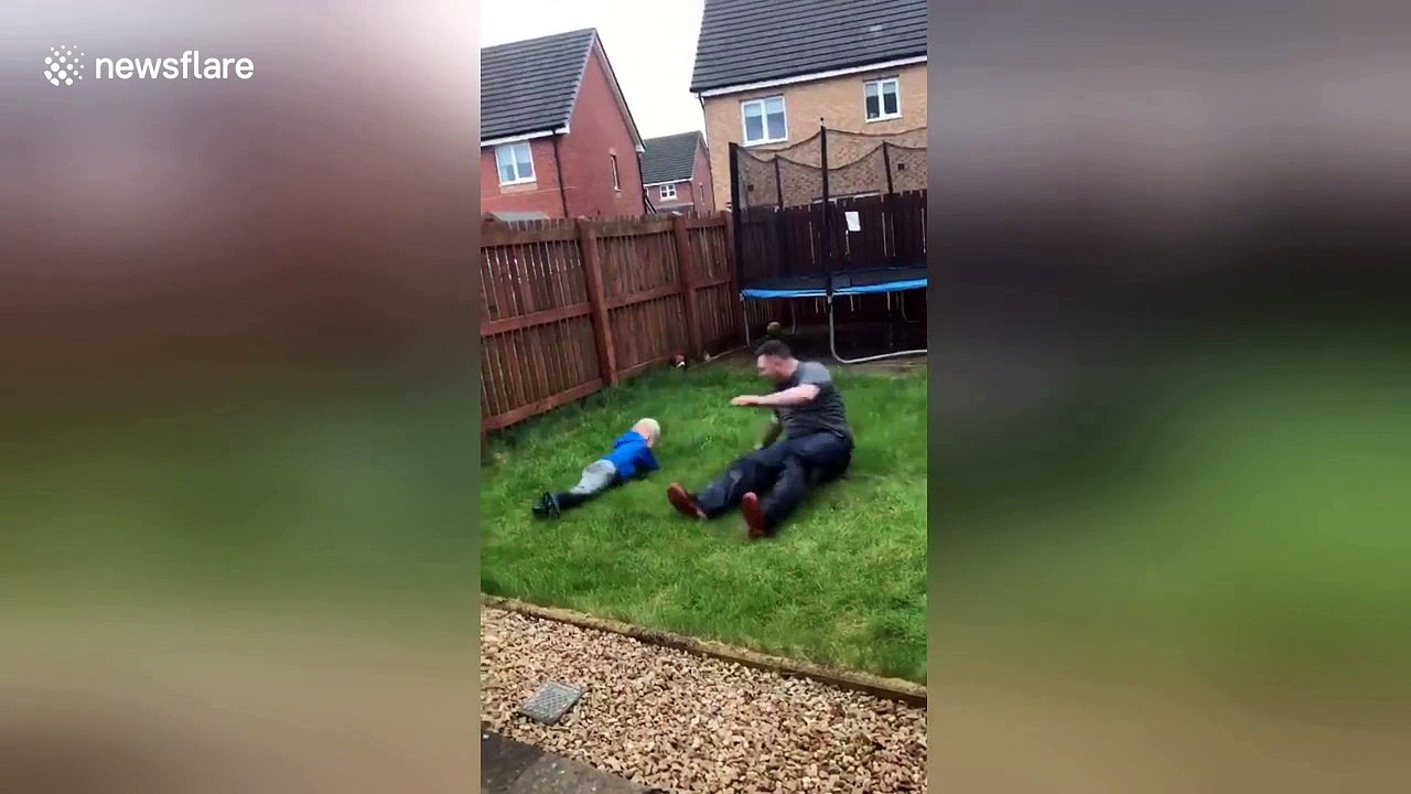 Hilarious moment UK dad slide tackles 4-year-old son
