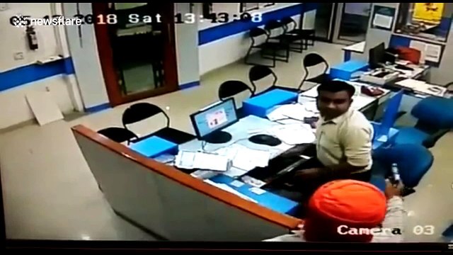 Brave clerk chases after bank robbers despite getting shot twice