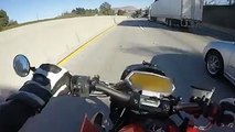 Dude is lucky to be alive! Motorcyclist Crashes And Slides Underneath Semi