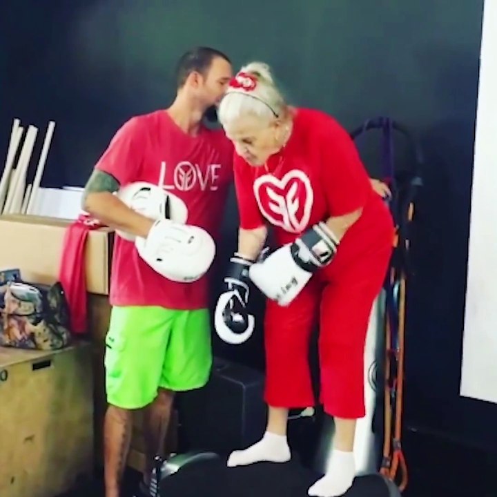 Elderly Woman Performs Boxing Work Out