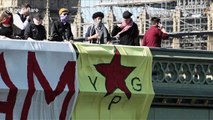 Anti-Erdogan protesters hang huge banner from Westminster Bridge