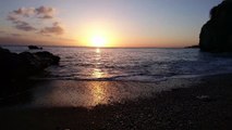 Waves Crashing On Shore During Sunset