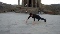 Bruce Lee-inspired man pulls off two-finger push-ups at ancient Armenian temple