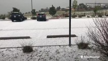Hail-covered ground looks like snow in Colorado Springs