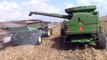 Four John Deere S670 Combines Harvesting Corn