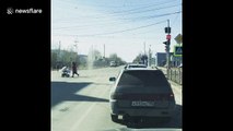 Dust devil chases old lady across street in Russia