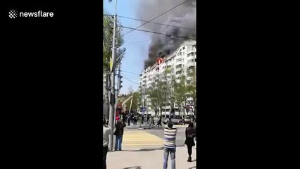 Massive fire sweeps through residential building in Russia