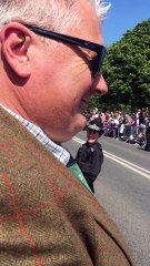 Police Entertain Crowd While Waiting for Royal Newlyweds