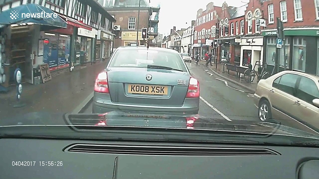 Out-of-control car slams into waiting vehicle after reversing across UK high street