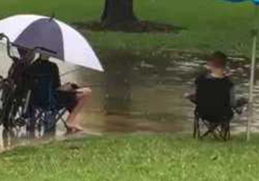 Florida Kids Fish in Flooded Roadway After Heavy Rain