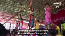 Hovering kids go political in Hong Kong festival parade