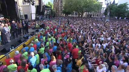 Crowd falls silent at Manchester vigil